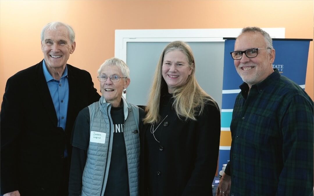 group photo of people smiling at the Tacos and Taxes event