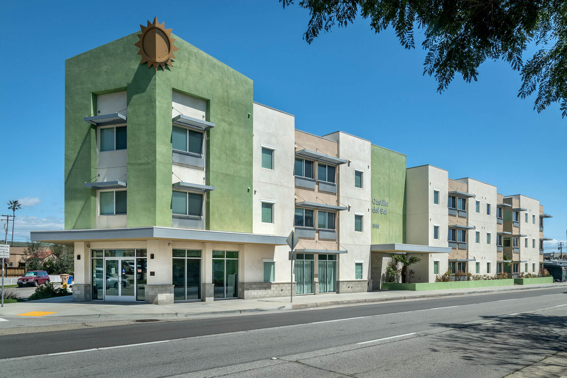 green and white corner building exterior