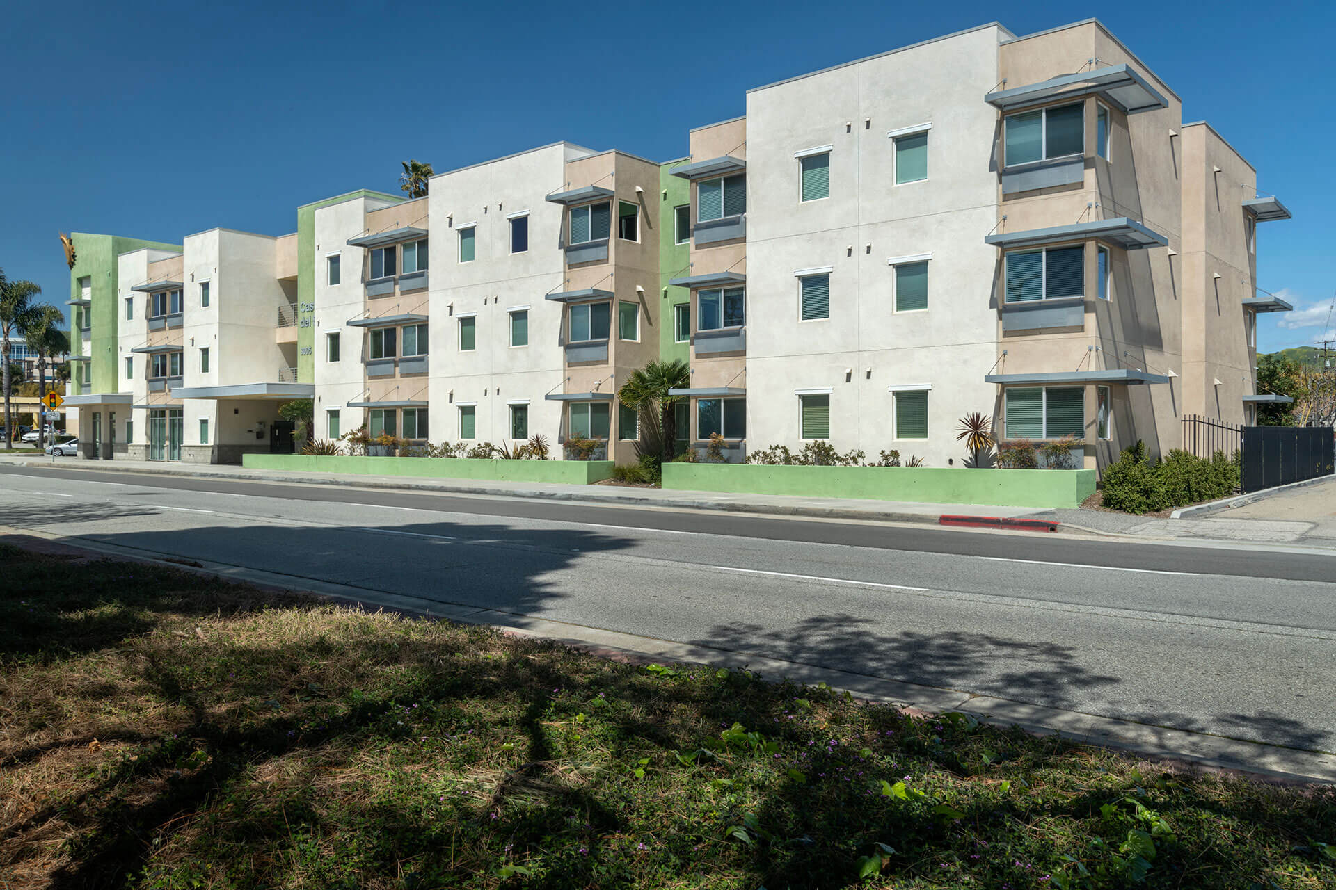 green and white three story building exterior