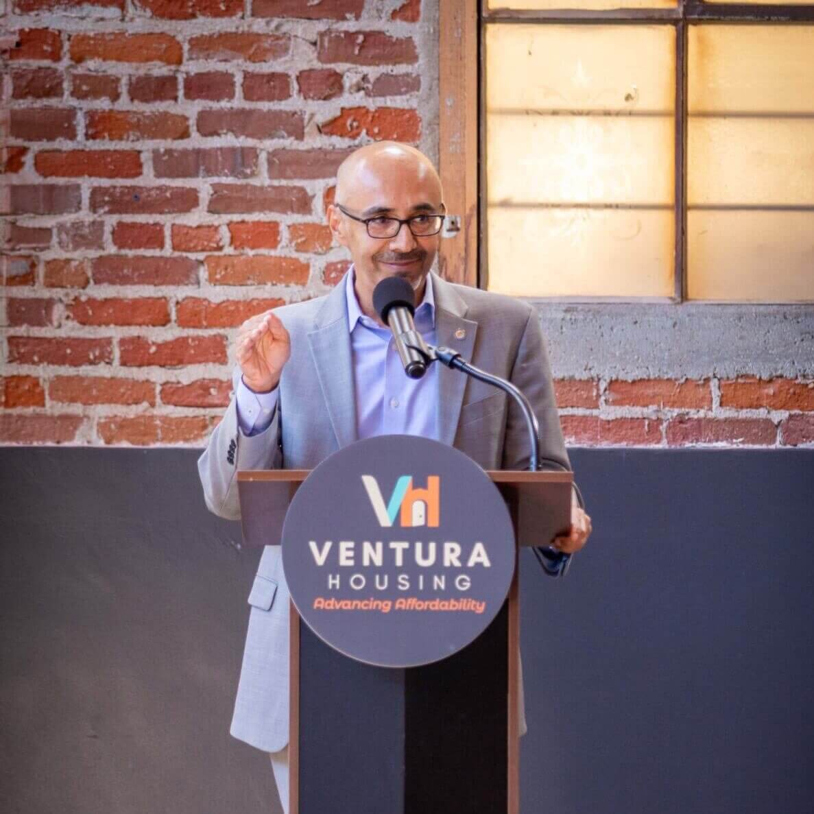 man speaking at a podium