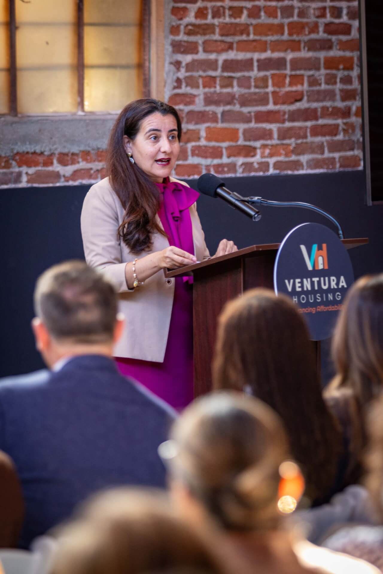 woman speaking at a podium