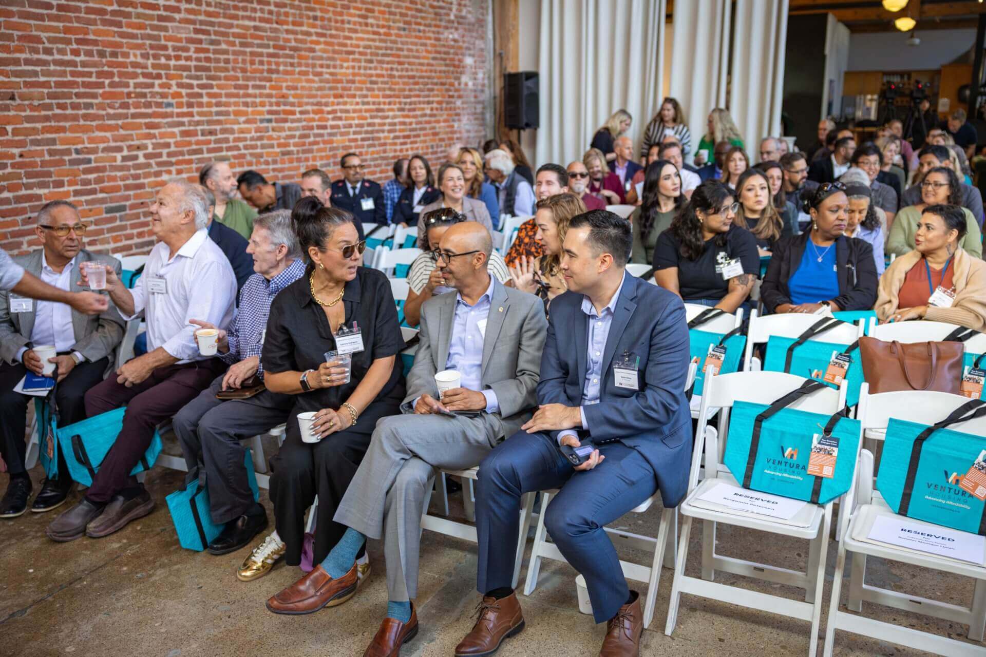 people sitting in the audience and talking