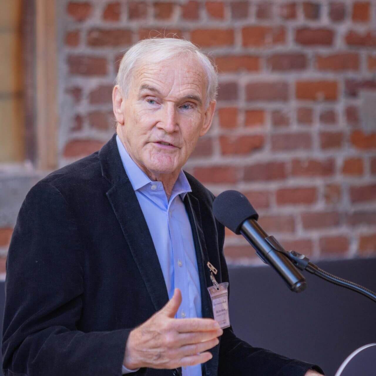man speaking at a podium