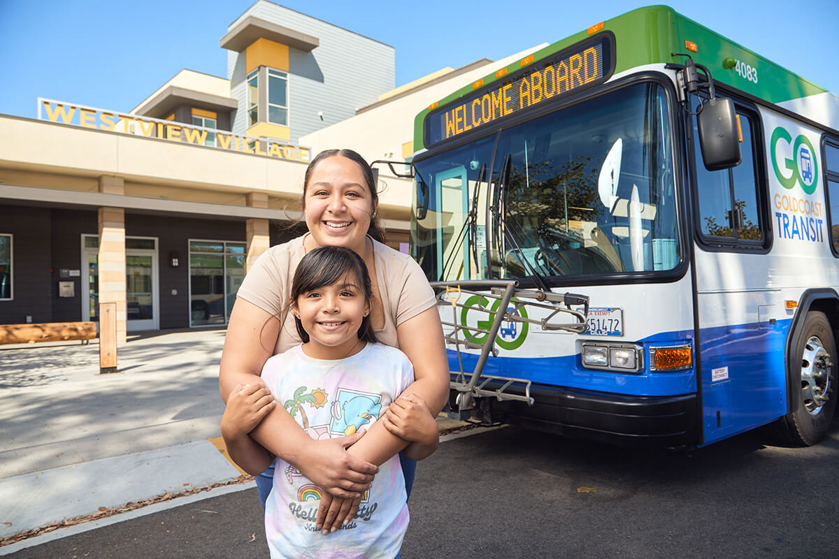 woman and child hugging and smiling